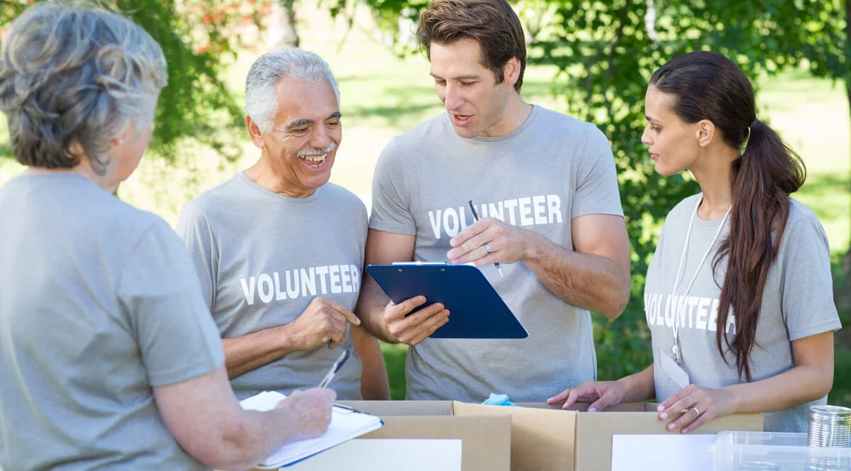 charity volunteers checking discussing the organization's compliance to law and regulations